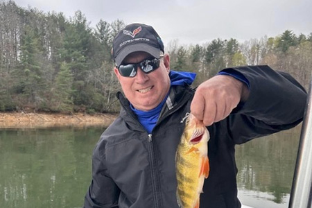  Man holds up trophy fish caught on 6-hour trip.